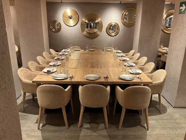 El Bajío dining room with round gold mirrors
