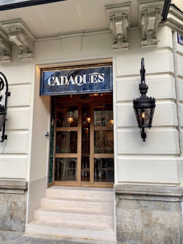 Cadaqués entrance with tiled sign and lanterns