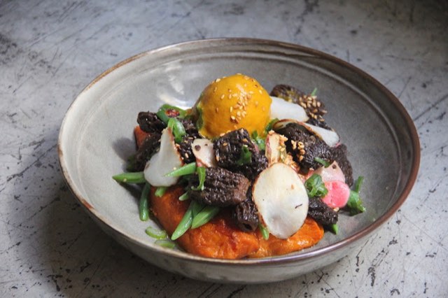 Mushroom dish with egg yolk at El Brote